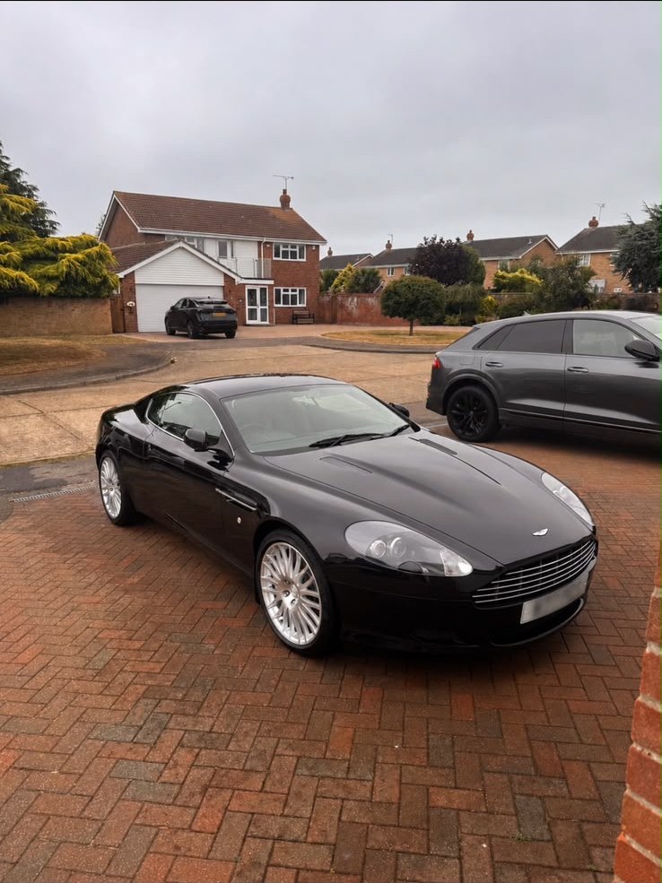 Aston Martin DB9 parked on a driveway after a valet